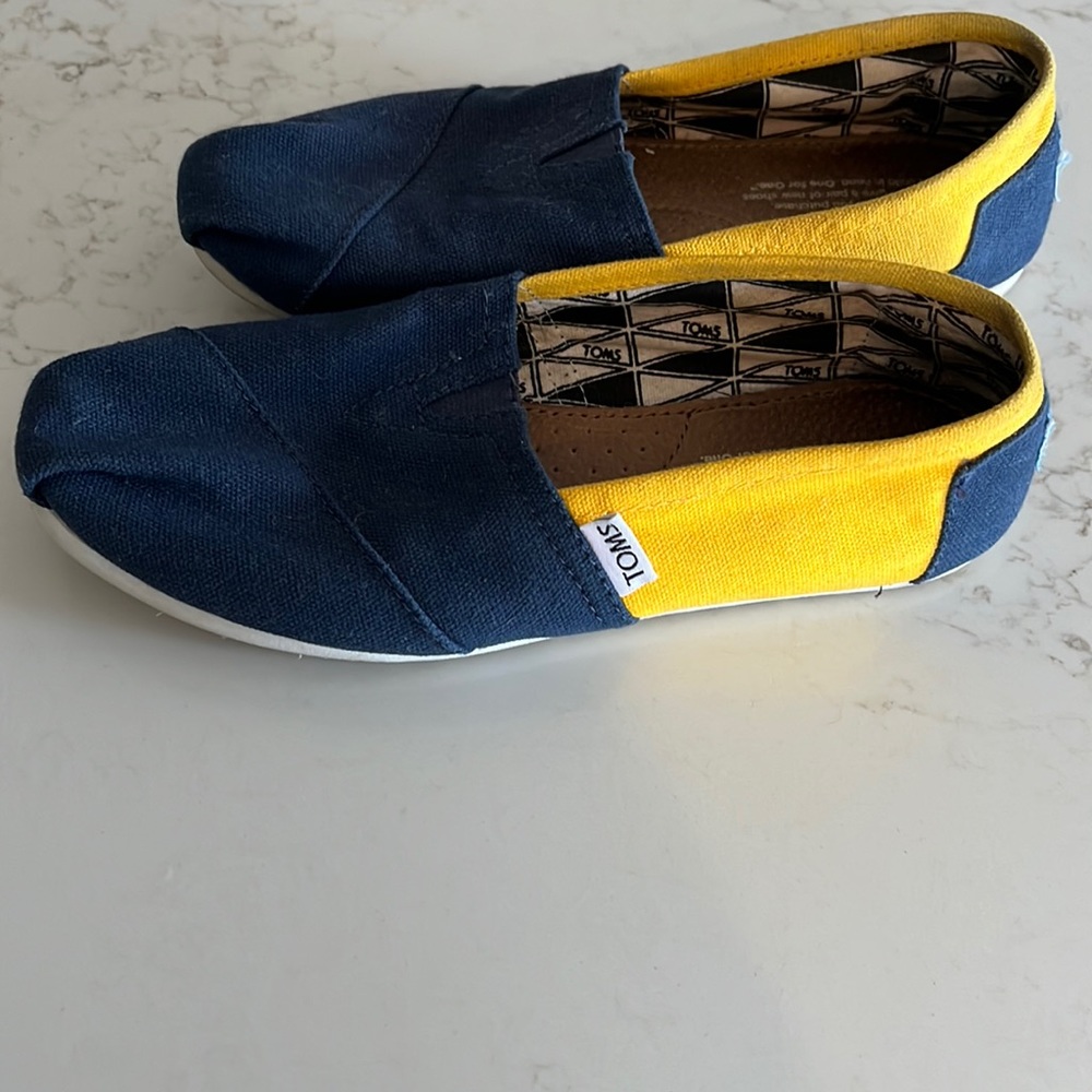 Women’s blue and gold TOMS